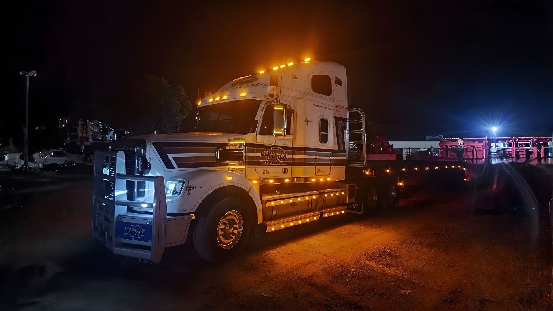 Truck with all it's lights on at night