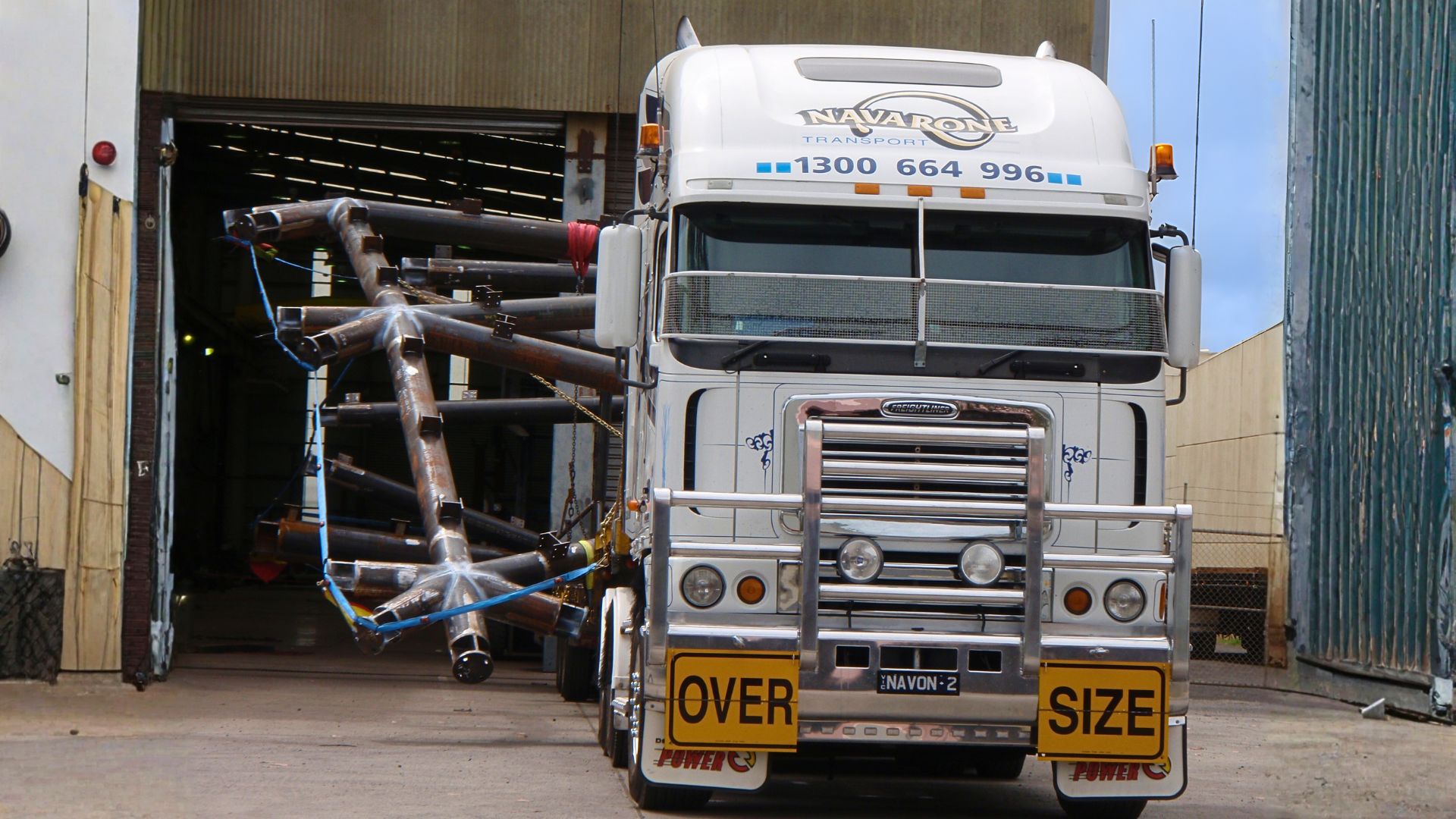 Truck carrying a large load of steel